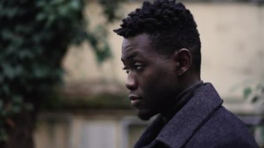 Hopeful young black man head looking up to sky with FAITH