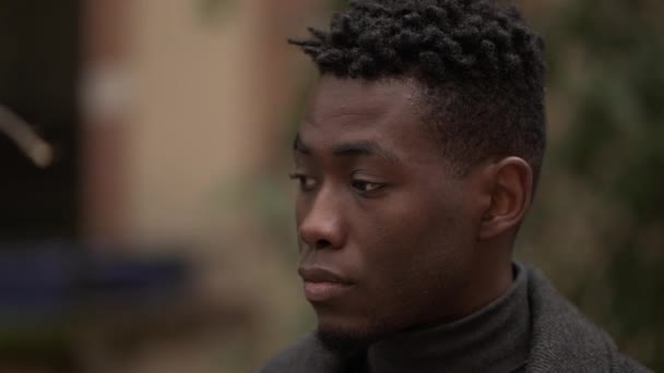 Contemplative Young Black Man Meditative Expression Close Face — Stock Video
