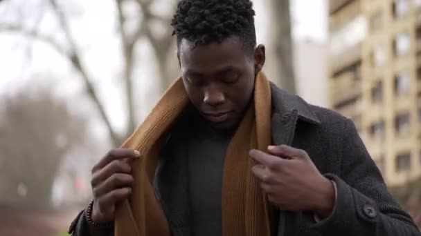Black Man Putting Scarf Outdoors Winter Season African Guy Adjusting — Wideo stockowe