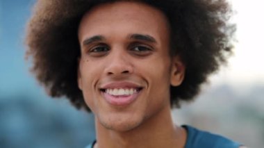 Happy young black man spontaneous smile
