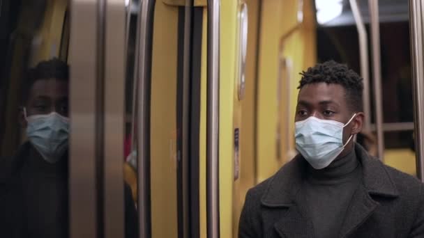 Black Man Wearing Covid Face Mask While Commuting Underground Subway — Stockvideo