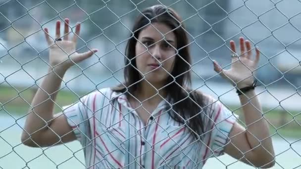 Angry Young Woman Holding Urban Fence Upset Girl Imprisoned Concept — Video Stock