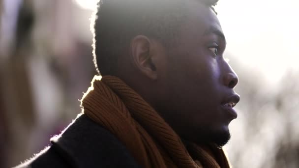 Young Black Man Standing Sunflare Sunlight Pensive Thoughtful — Vídeo de Stock