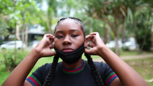 African Woman Putting Covid Face Mask Black Girl Walks Camera — Stockvideo