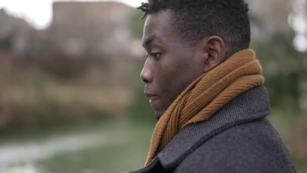 Thoughtful Contemplative Young Black Man Standing Reflection Thoughts — Wideo stockowe