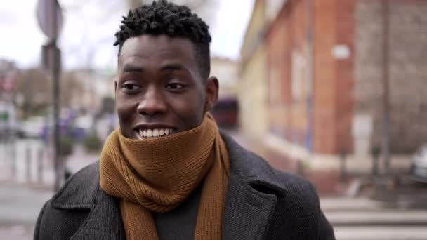 Happy Smiling Black Man Adjusting Scarf Cold — Vídeos de Stock