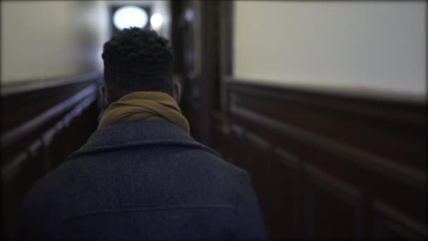 Young Black Man Walking Corridor Leaving House Person Getting Out — Vídeo de stock