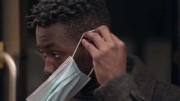 Young Black African Man Wearing Covid Face Mask While Commuting — Stock Video