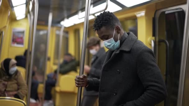 African Man Standing Subway Metro Wearing Coronavirus Mask Underground — Wideo stockowe