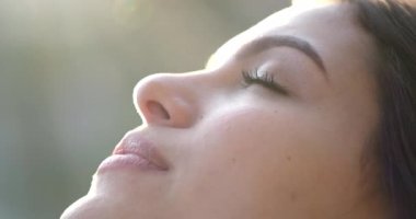 Contemplative young woman with eyes closed in meditation