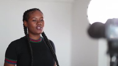 African girl vlogger speaking at camera virtual audience