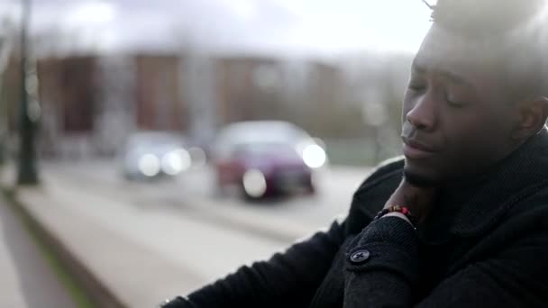 Preoccupied Young Black Man Sitting Sidewalk Curb City — 비디오
