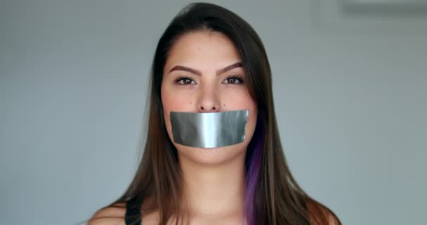 Woman Mouth Taped Looking Camera — Vídeos de Stock