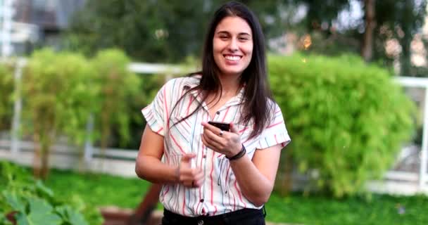 Millennial Woman Celebrating Fist Success Holding Smartphone — Stock videók