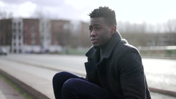 Pensive Worried Black African Man Feeling Anxious Concerned Sitting Sidewalk — стоковое видео
