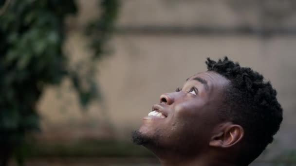 African Man Face Looks Feeling Grateful Seeking Divinity — Video