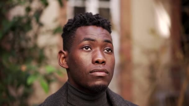 Pensive Young Black African Man Standing Outdoors — Video