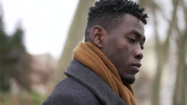 Pensive black African man close-up face thinking about issues