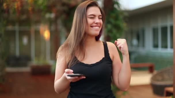 Young Woman Celebrates Success Fist Candid Millennial Raising Fist Joy — Vídeo de stock