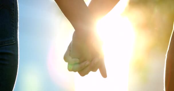 Close Hands Joining Together Sunlight Flare Background — Video