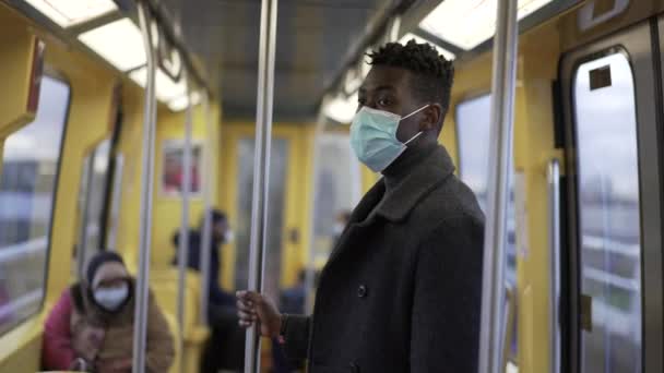 African Man Standing Subway Metro Wearing Coronavirus Mask Underground Commute — Αρχείο Βίντεο