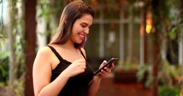 Happy Millennial Girl Celebrating Success Fist Using Cellphone — Stockvideo