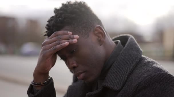 Worried Black Man Sitting Floor Street Having Problems Rubbing Face — Stock video