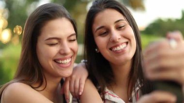 Friends taking selfie together. Women posing for photo