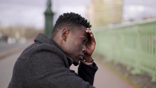 Preoccupied Black African Man Sitting City Street Curb Feeling Anxiety — Video