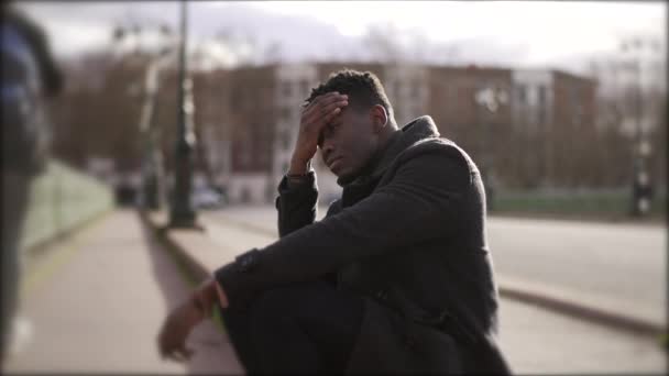 Worried Black Man Sitting Floor Street Having Problems Rubbing Face — Vídeos de Stock