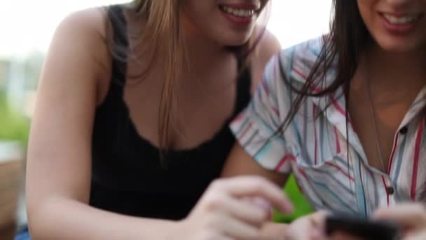 Millennial Girls Using Cellphones Two Female Friends Checking Smartphone Communication — Vídeo de stock