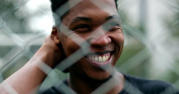 Happy Black African Man Smiling Laughing Metal Fence Foreground — 图库照片