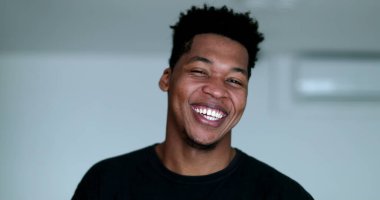 Happy young African American black man laughing and smiling