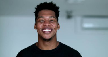 Happy young African American black man laughing and smiling