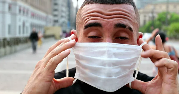 Hispanic Man Putting Covid Face Mask Downtown City — Stok fotoğraf