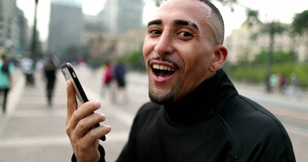 Happy Hispanic Man Receiving Good News Smartphone Celebrating — ストック写真