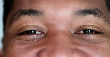 Macro close-up of african american man closing eyes