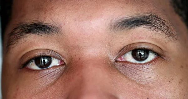 Serious African American man eyes macro close-up