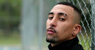 Hispanic man walking forward, south american latin guy serious face