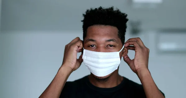Young Black Man Putting Adjusting Surgical Face Mask — Stock fotografie