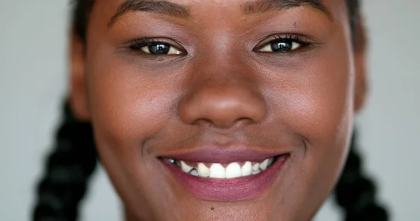 African girl smile close-up face. Black ethnicity female macro closeup