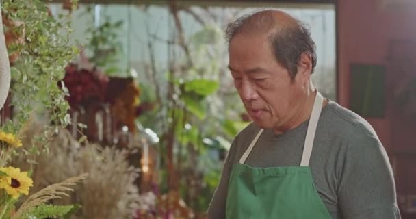 Asian American Business Owner Using Tablet Technology Small Business Store — Video