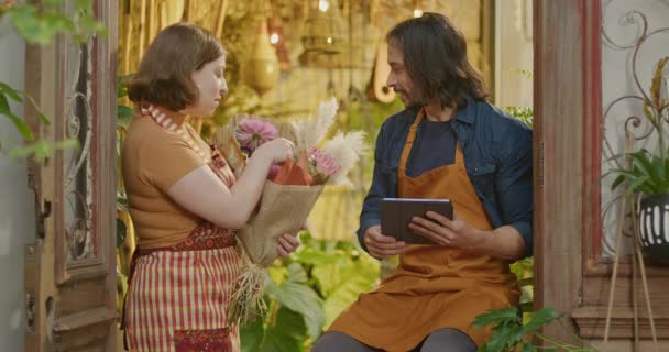 Two Happy Employees Holding Tablet Bouquet Flowers Small Local Flower — Video