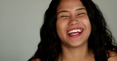 Excited happy hispanic girl cheering success reaction to great news