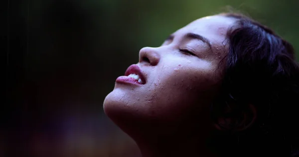 Close-up girl face in raining day outside