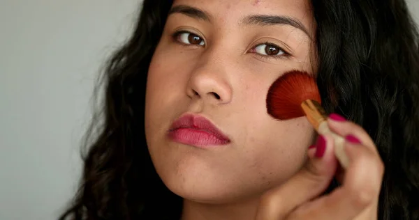 Casual Latina Hispanic Woman Applying Make Brush Looking Camera — стокове фото