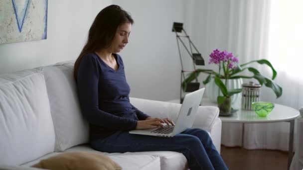 Person Sitting Couch Opening Laptop Working Remotely Home Woman Typing — 图库视频影像