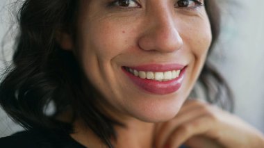 Closeup mouth smiling. One hispanic latin girl smile