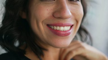 Closeup mouth smiling. One hispanic latin girl smile