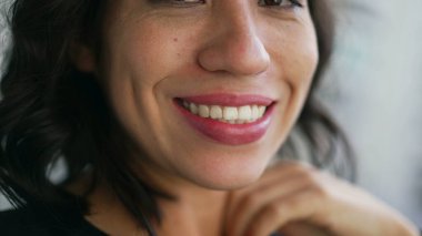 Closeup mouth smiling. One hispanic latin girl smile